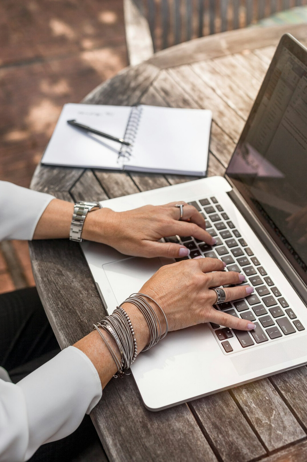 author typing on laptop